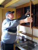 On a cold wet day in winter there could be no better place to be than refurbishing the cabinets in the galley. Marc's a craftsman.